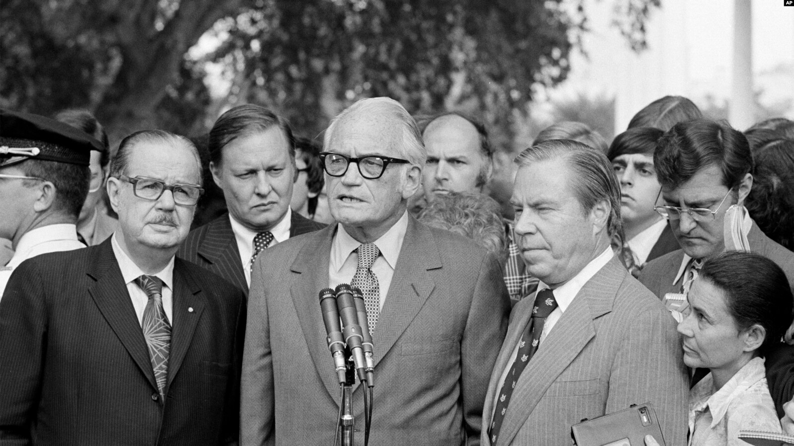 Barry Goldwater (R-AZ) riz., center, speaks after meeting with President Richard Nixon, Aug. 7, 1974, about resigning. With him are Senate Republican Leader Hugh Scott of Pennsylvania, left, and House GOP Leader John Rhodes of Arizona, .