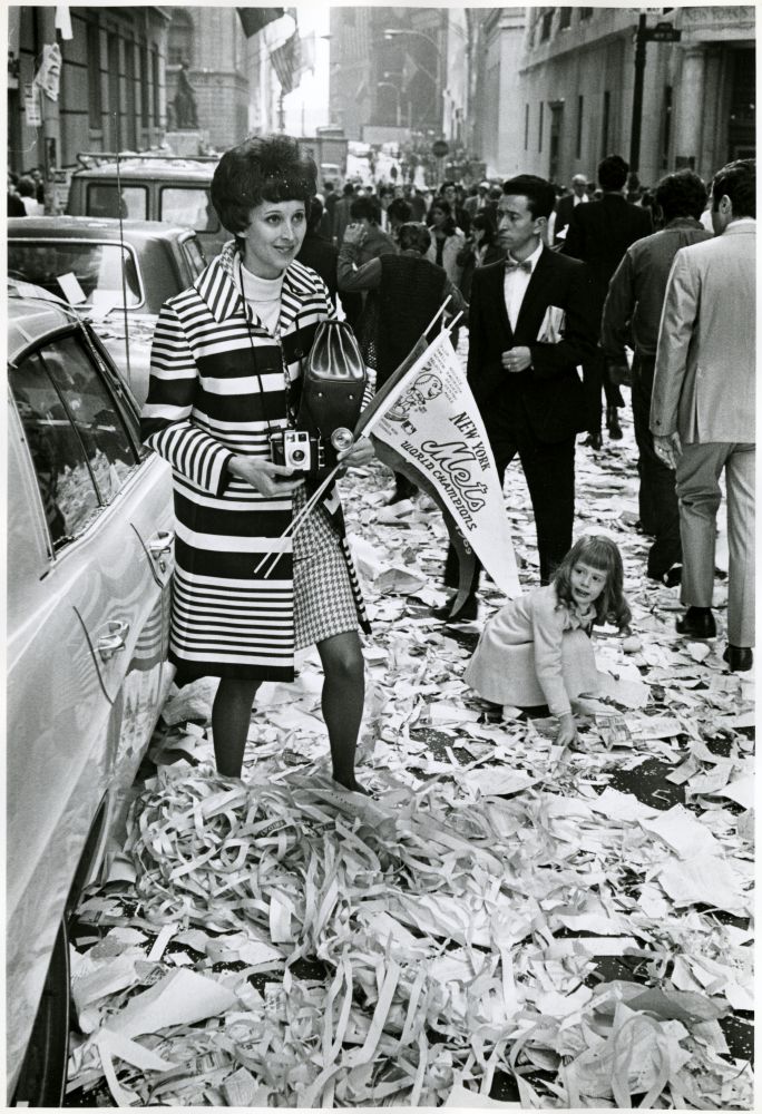 A woman celebrates the Mets winning of the World Series. Photo by James Jowers