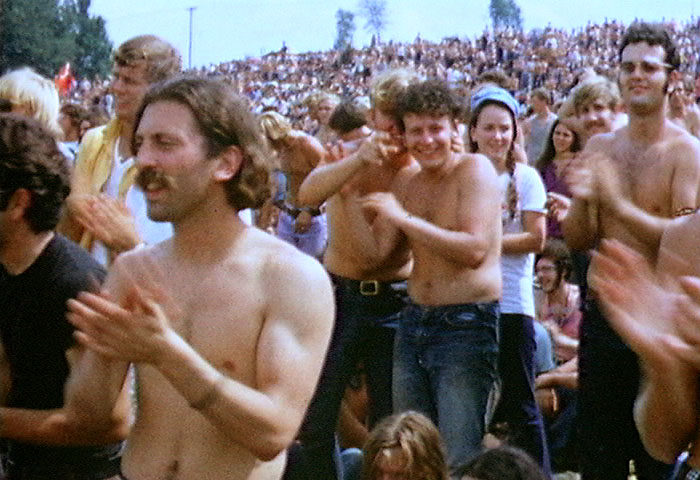 Woodstock festival goers react to prompts from the stage. Photo courtesy of Wikipedia